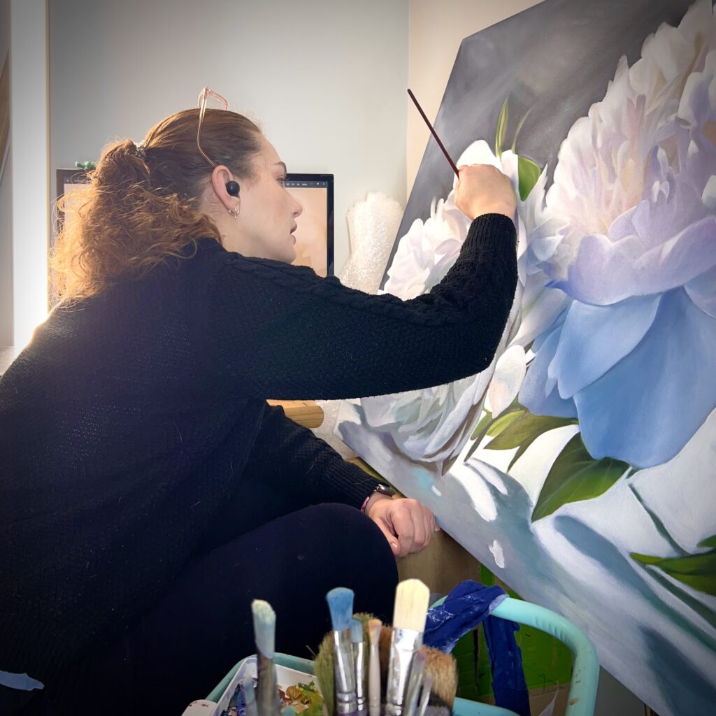 Melissa Eybers working on an oil painting.